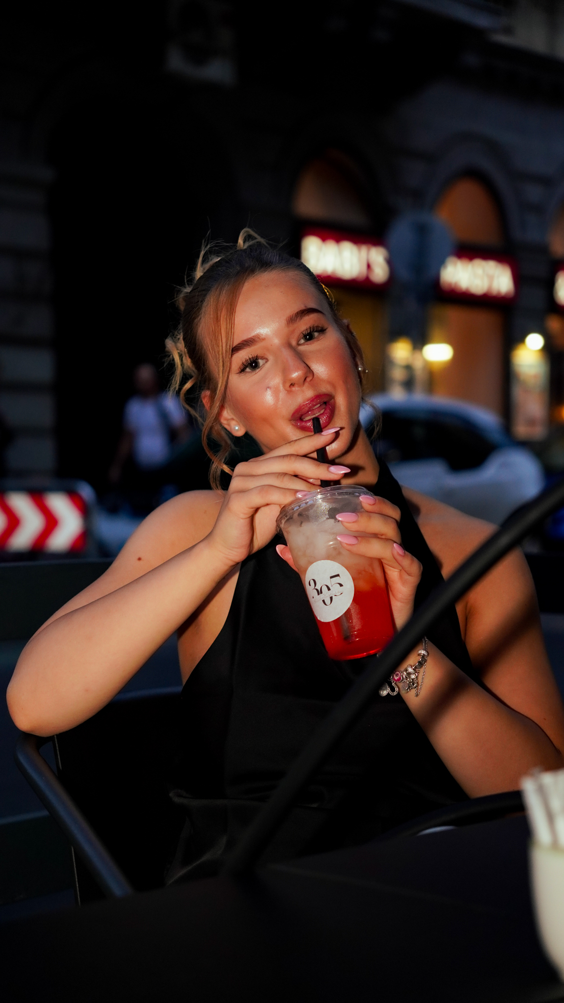 Guest enjoying a refreshing red cocktail